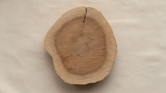 Natural sandalwood heartwood block showcasing the rich grain and texture of sustainably harvested Santalum album.