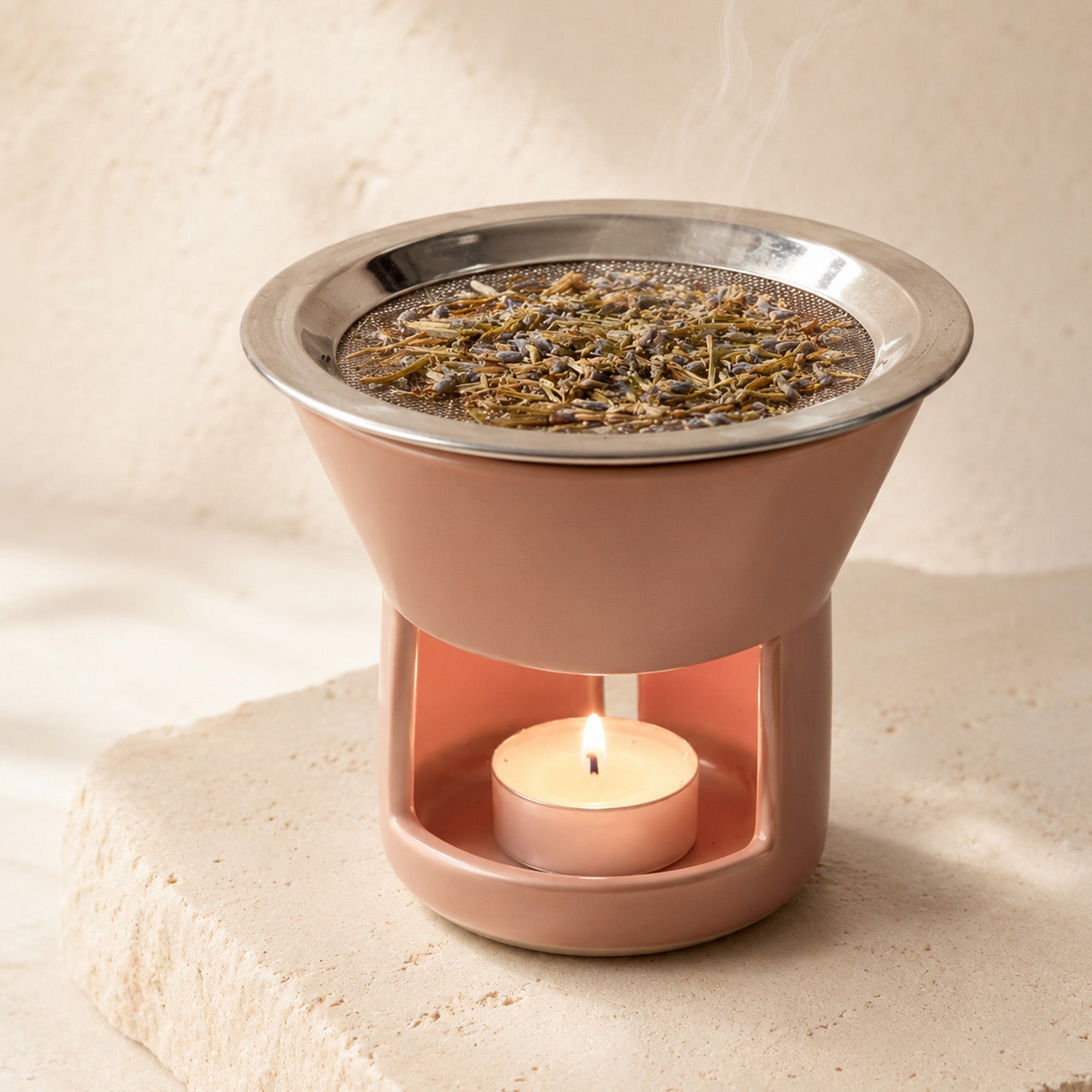 Loose botanical incense warming on a ceramic incense holder with mesh screen