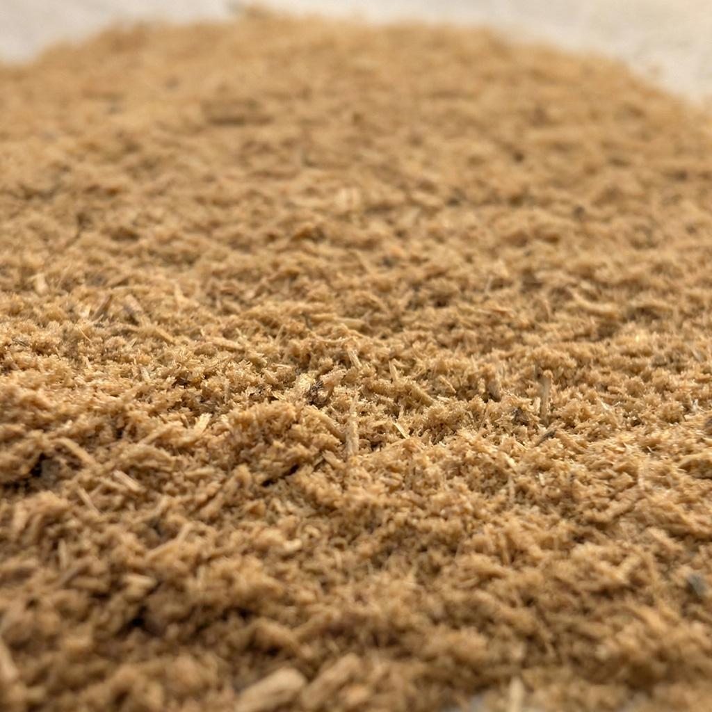 Close-up of sandalwood balloon dust showing its fine heartwood texture